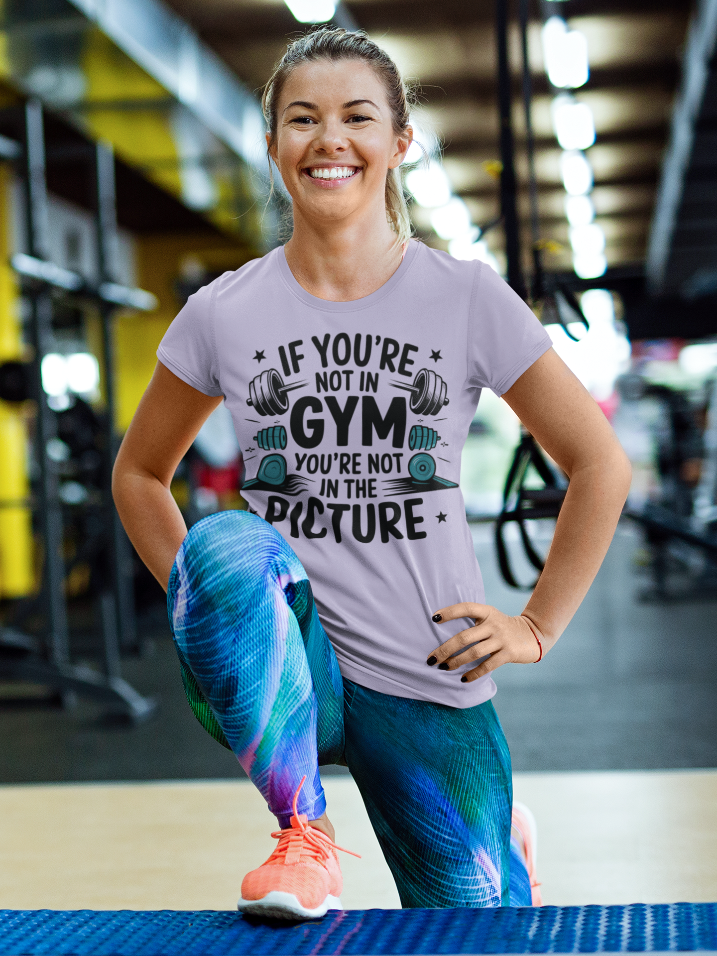 Minimal black-and-white logo designed for fitness lovers, featuring a bold t-shirt icon with the motivational phrase "FUEL YOUR FIRE" and the words "MOTIVATIONAL TEES" encircling it in a clean, circular design.